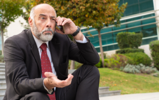 man talking on phone confused by legal jargon
