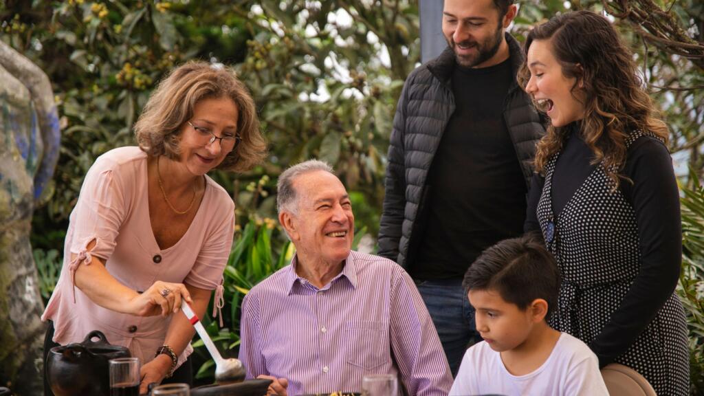 A multigenerational family meeting together for a celebration.