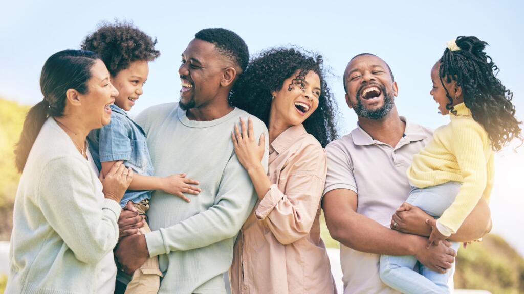 An extended family celebrating outside together.