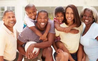 A multi-generational family posing for a picture.