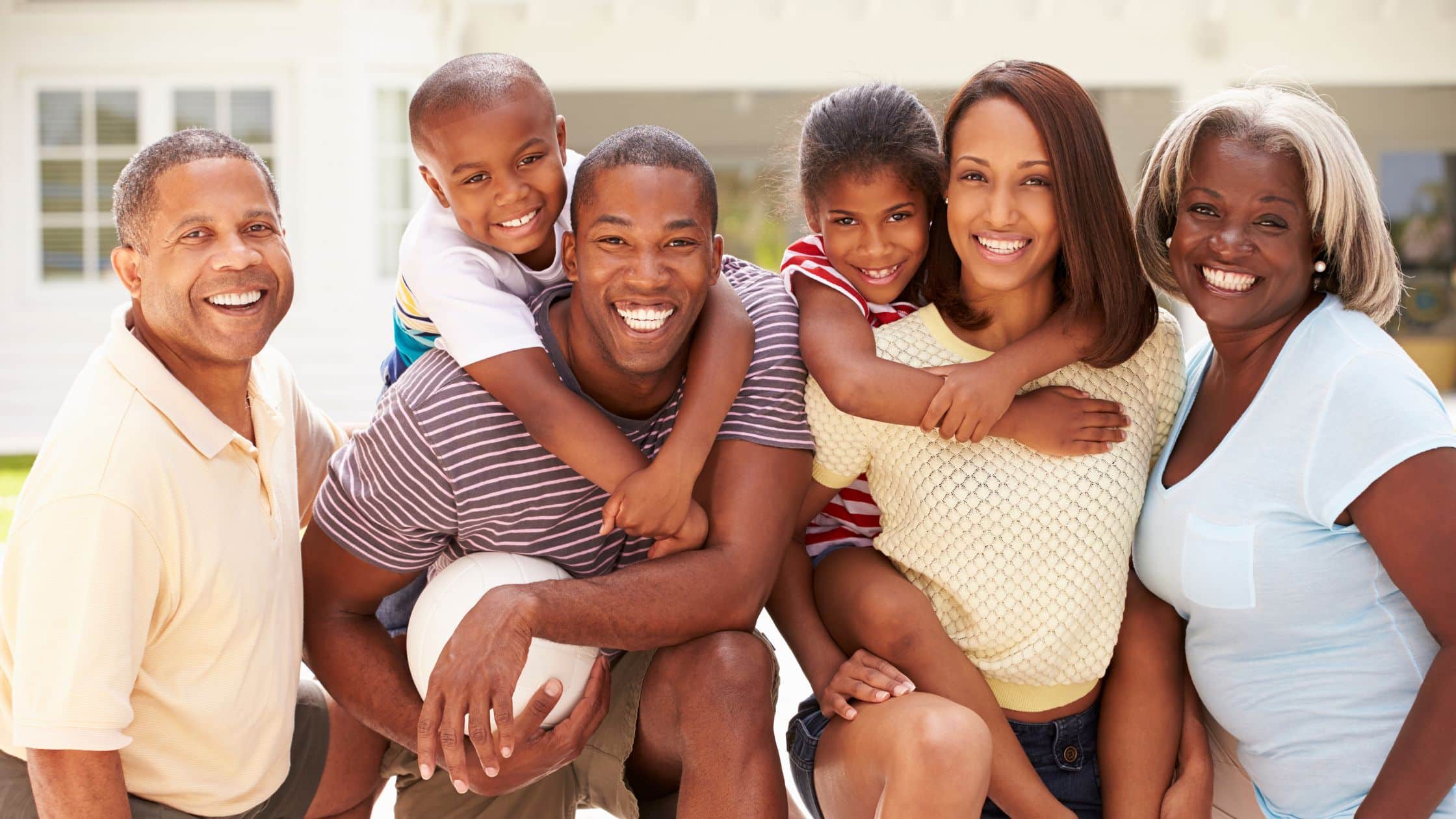 A multi-generational family posing for a picture.
