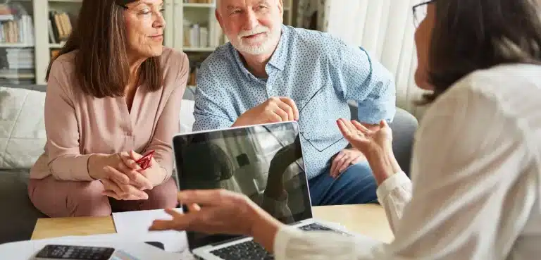 A couple discussing their estate plan with their attorney.