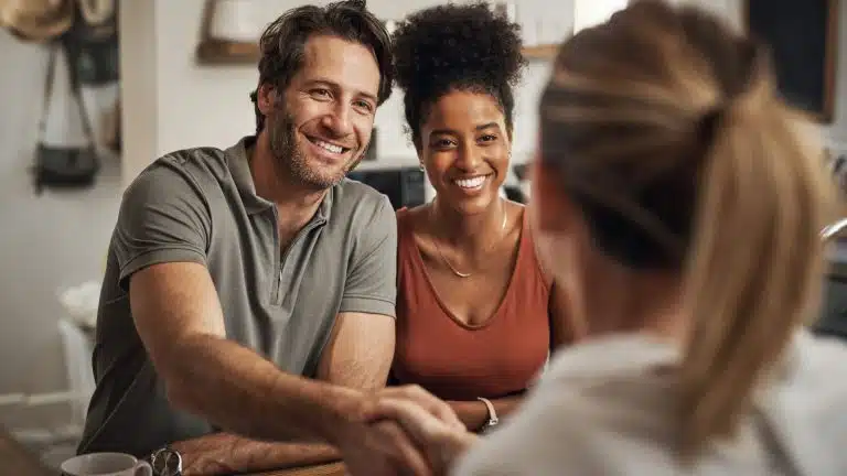 A married couple talking with an estate planning lawyer about their needs.